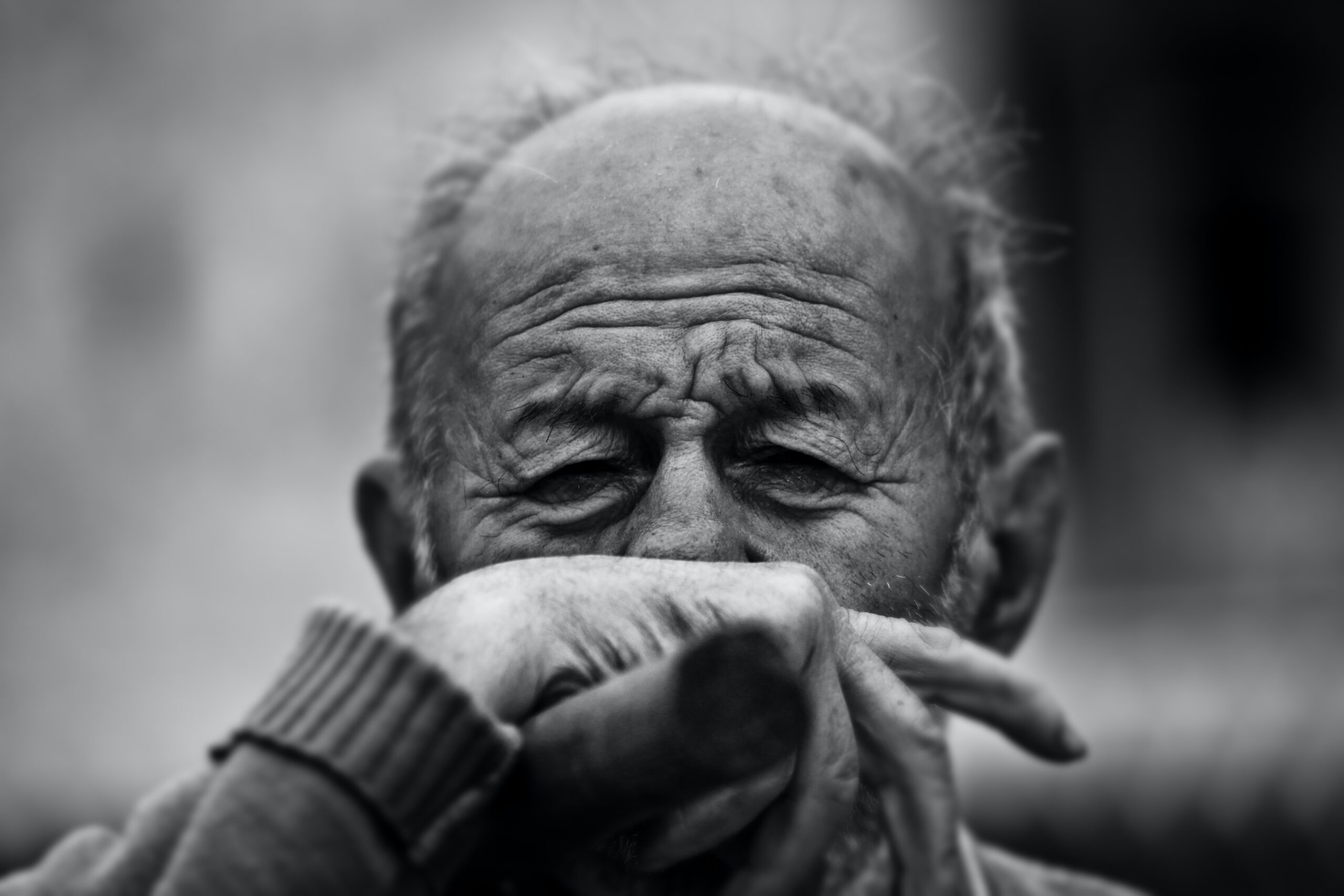 Sad elderly man, representing memory impairment seen in Alzheimer's disease and conditions like PTSD.